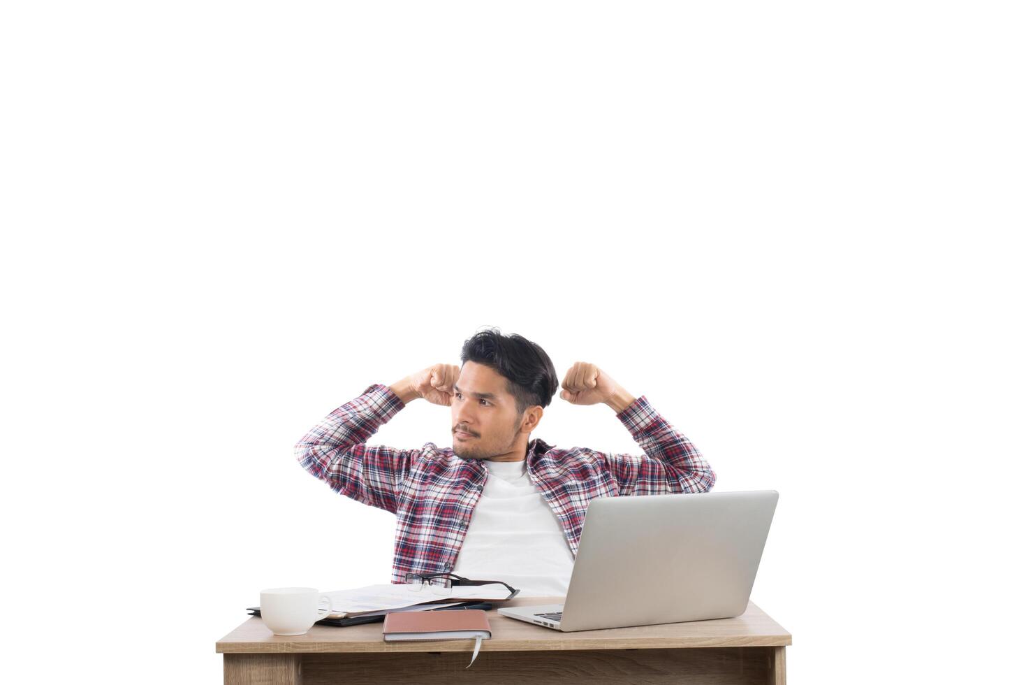 young successful businessman,arms raised celebrating with work isolated on white background. photo