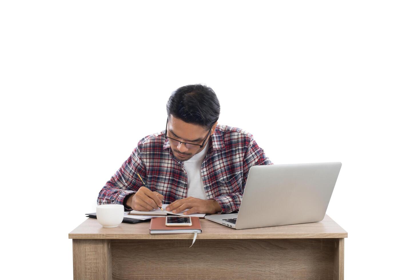 Young businessman working with his laptop isolated on white background. photo