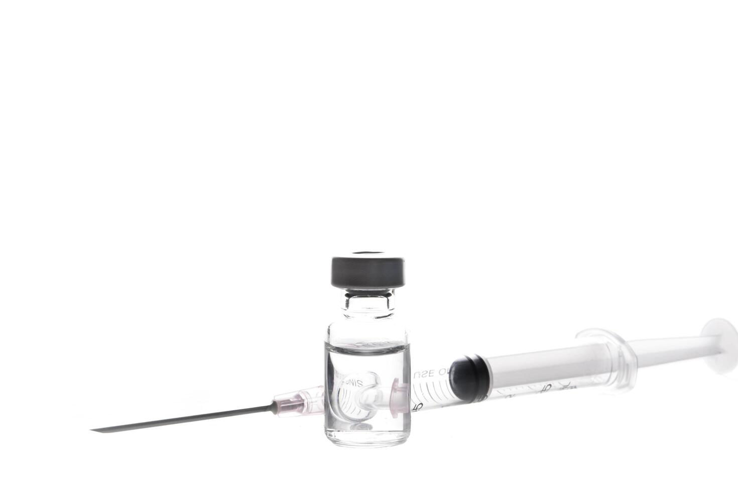 medical ampoules and syringe isolated on white blackground photo