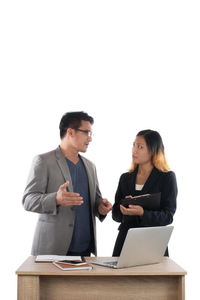 Young business woman standing with her boss conversation about the business at office isolated on white background. photo