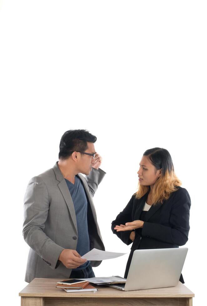 Young business woman standing with her boss conversation about the business at office isolated on white background. photo