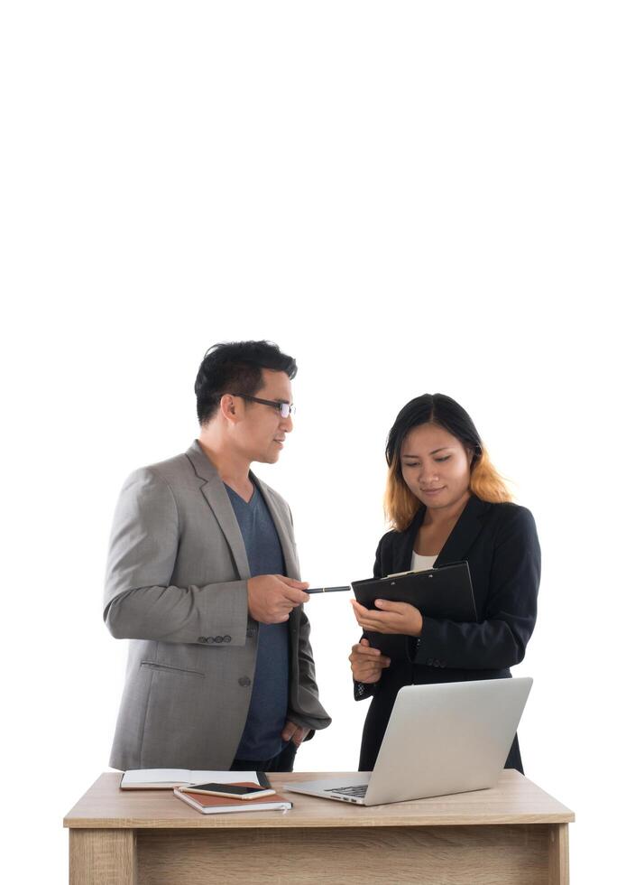 Young business woman standing with her boss conversation about the business at office isolated on white background. photo