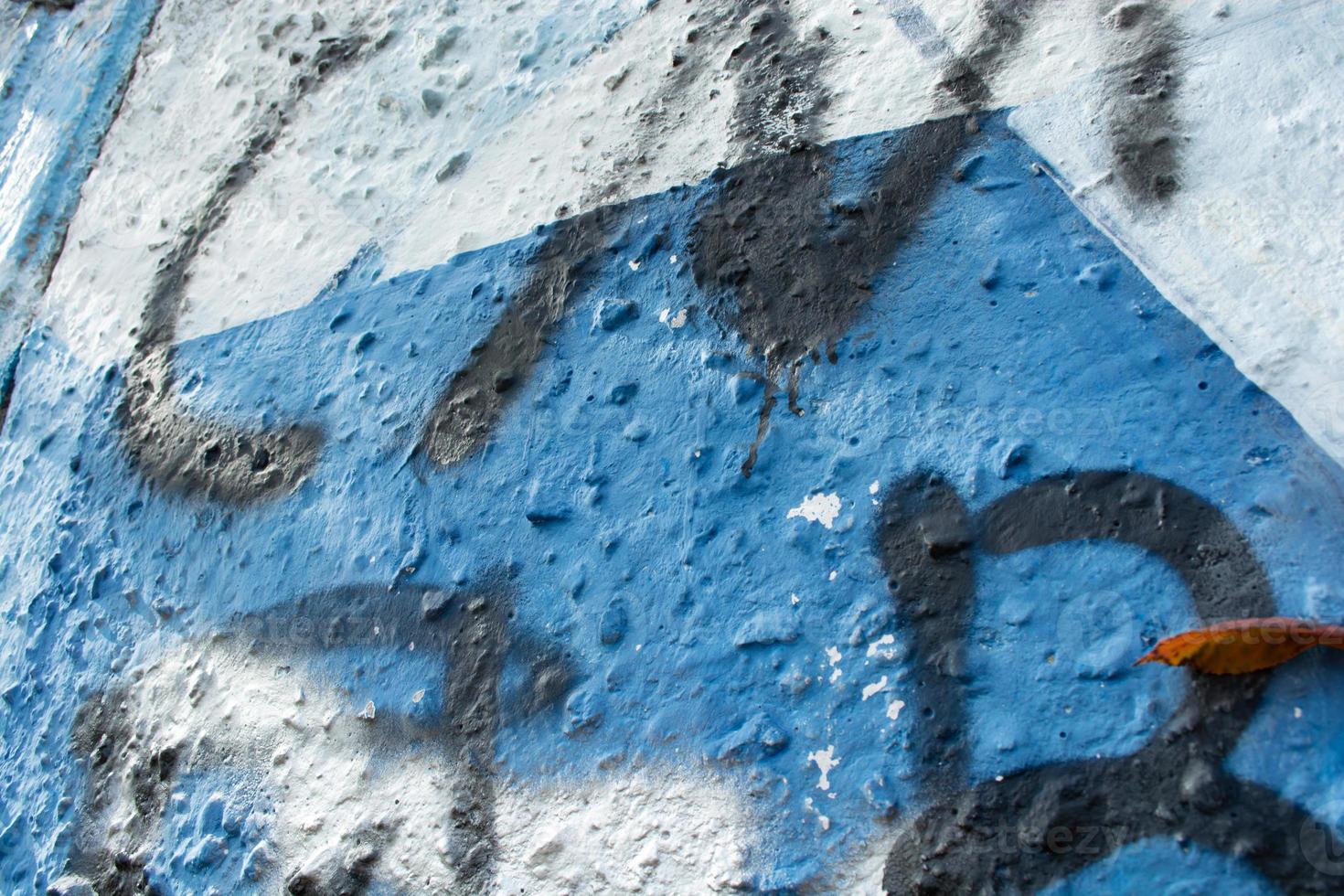 Inscriptions on an old painted wall. photo