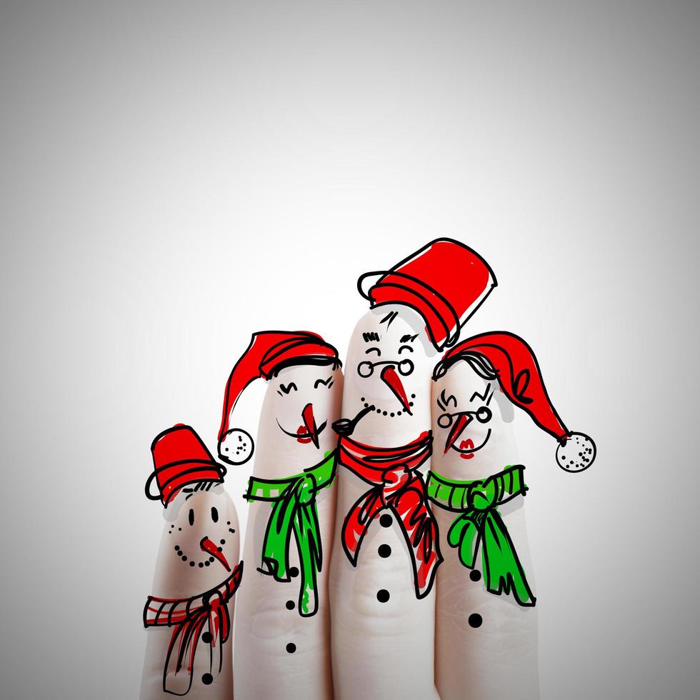 dibujado a mano y dedo de muñecos de nieve, como idea conceptual foto