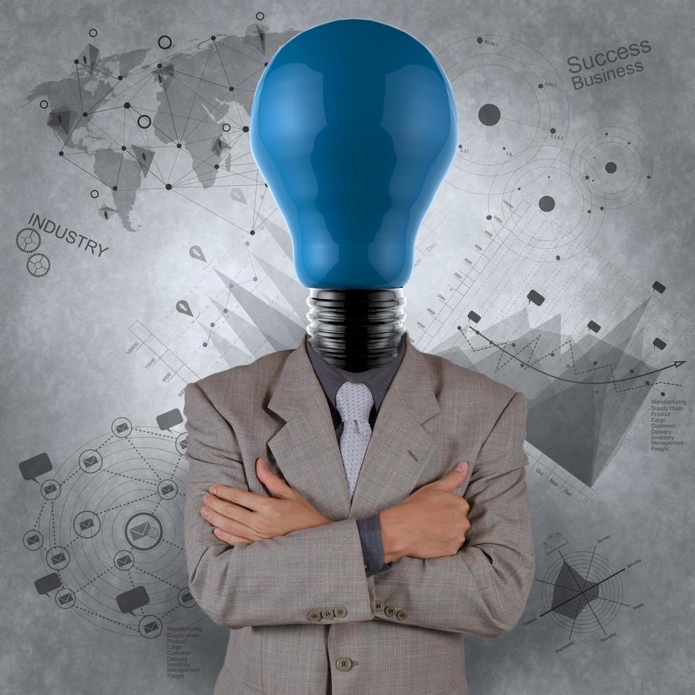 businessman with blue light bulb head as concept photo