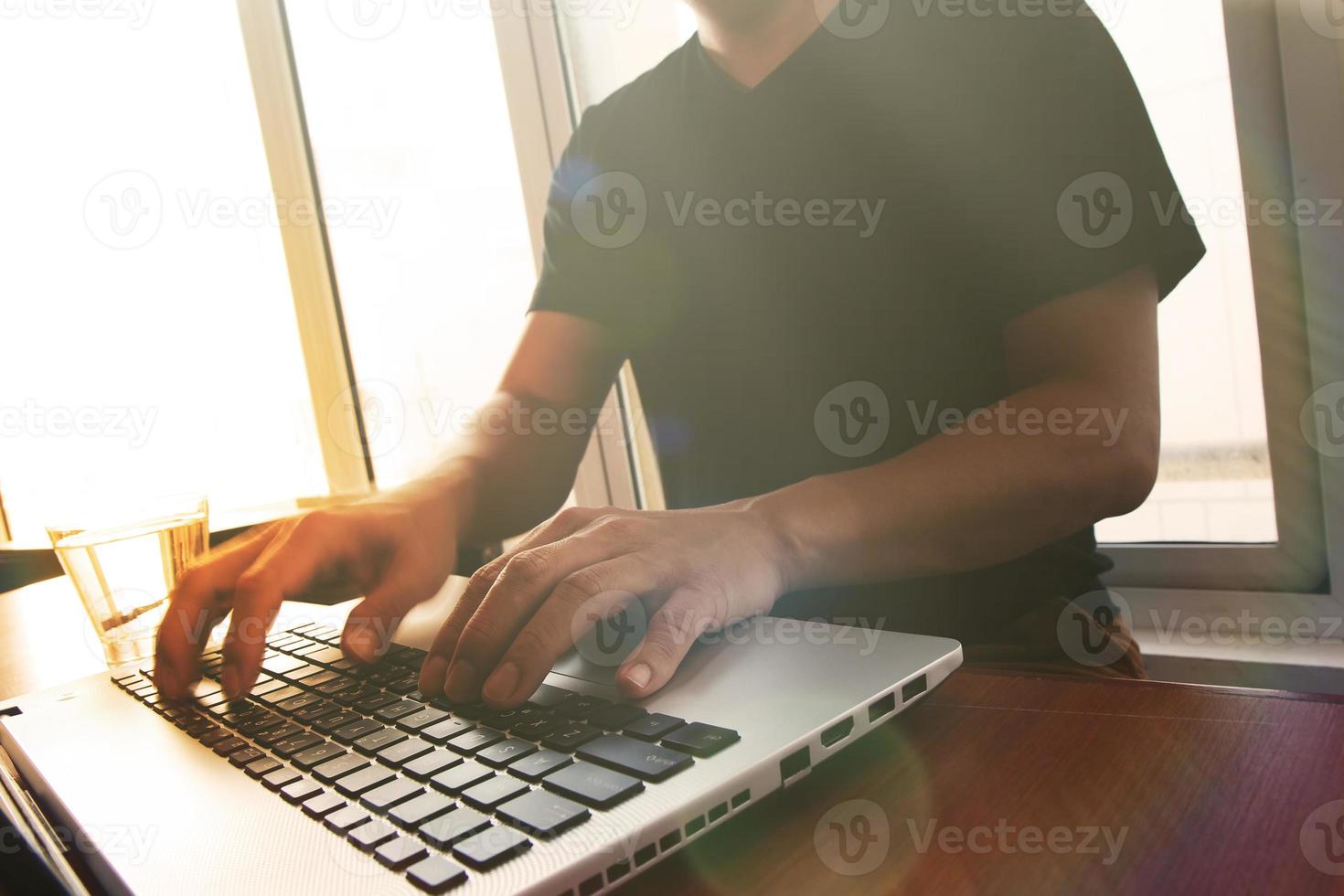 Young creative designer man working at office with computer laptop as concept photo