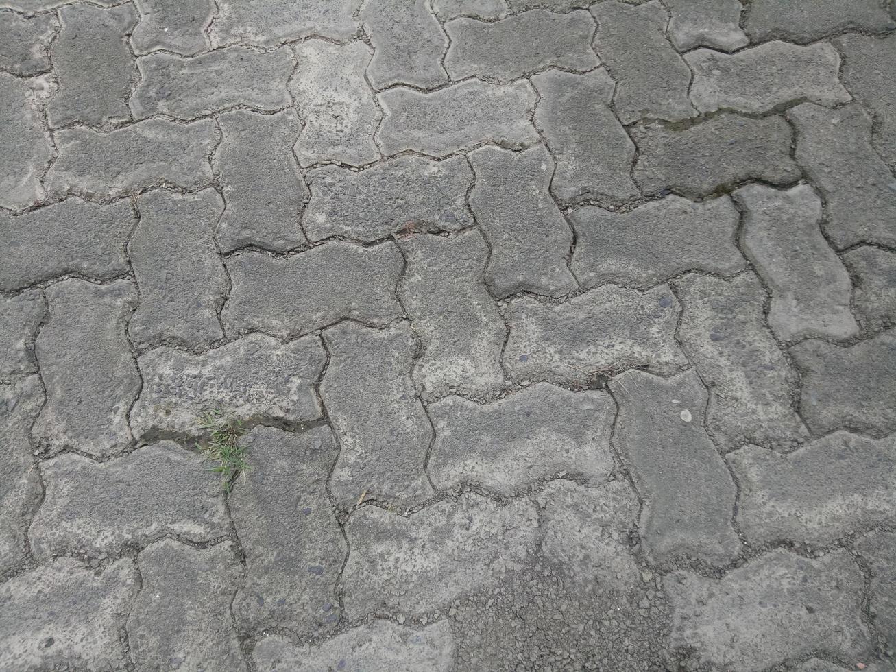 cracked and dirty brick paving roads photo