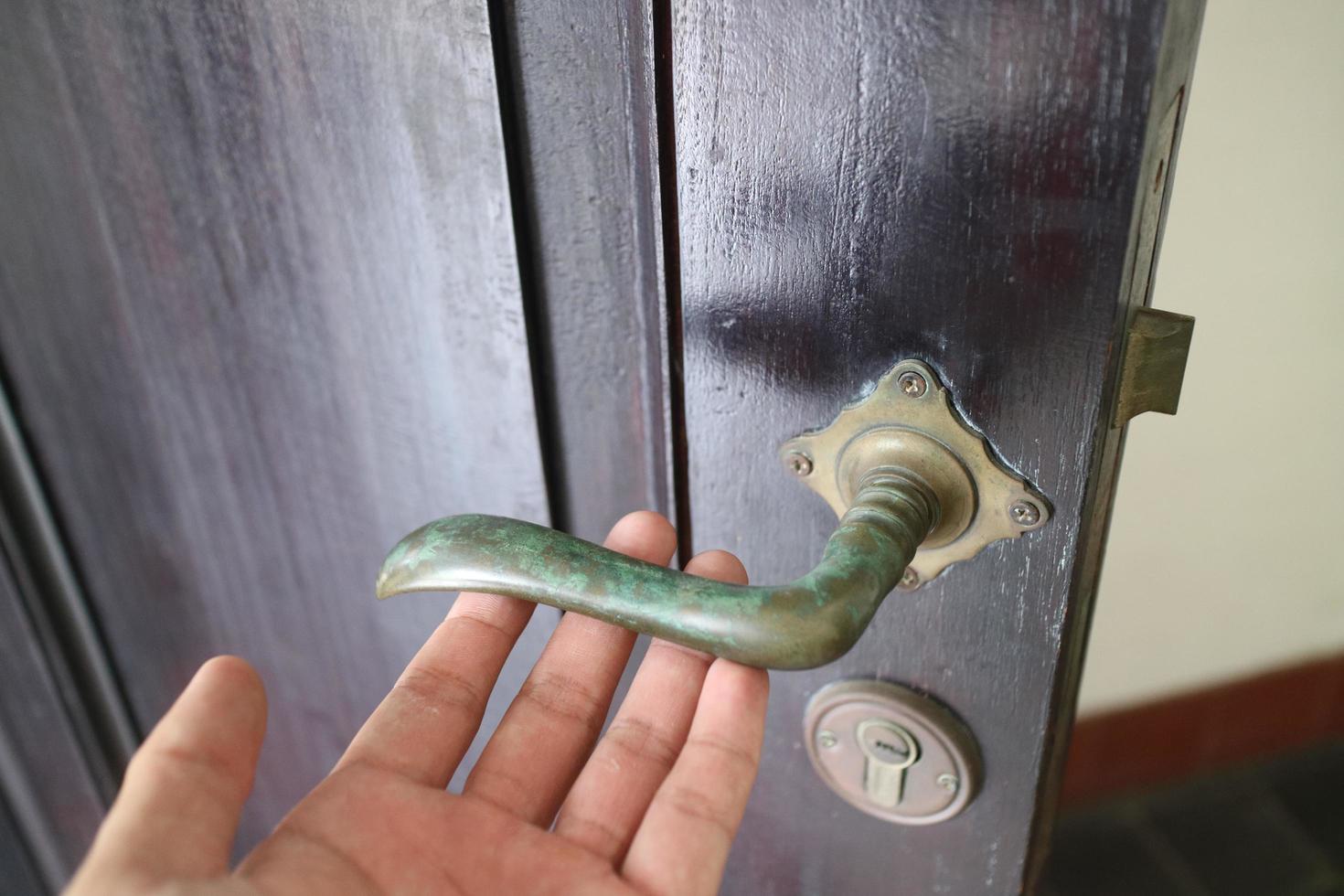 iron handle on old wooden door photo