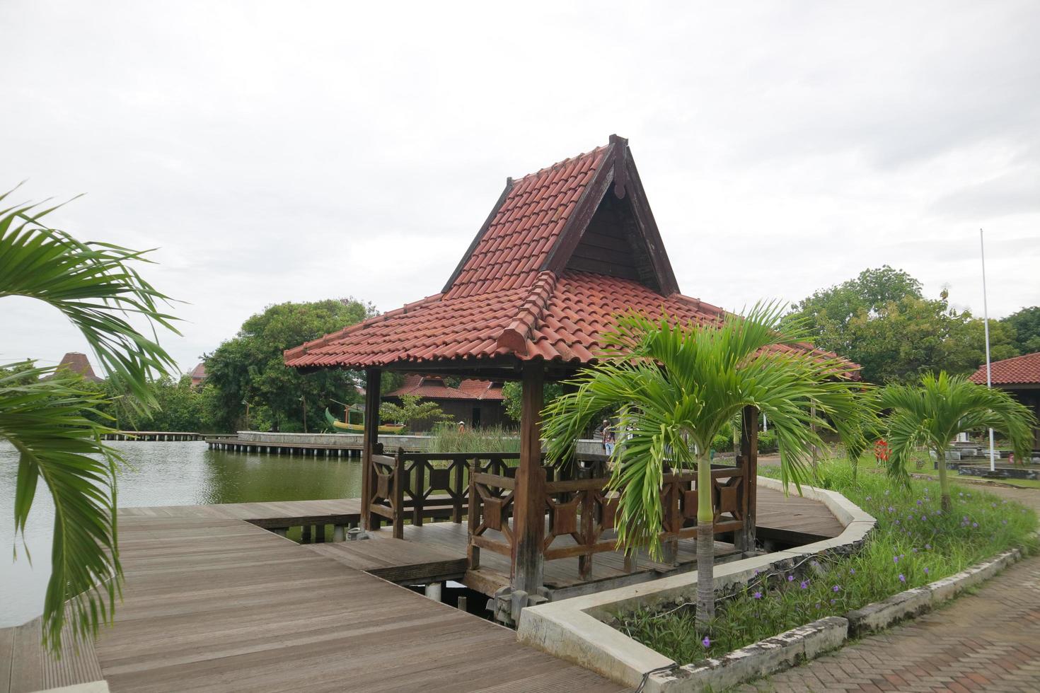 wooden gazebo on the edge of the swamp photo