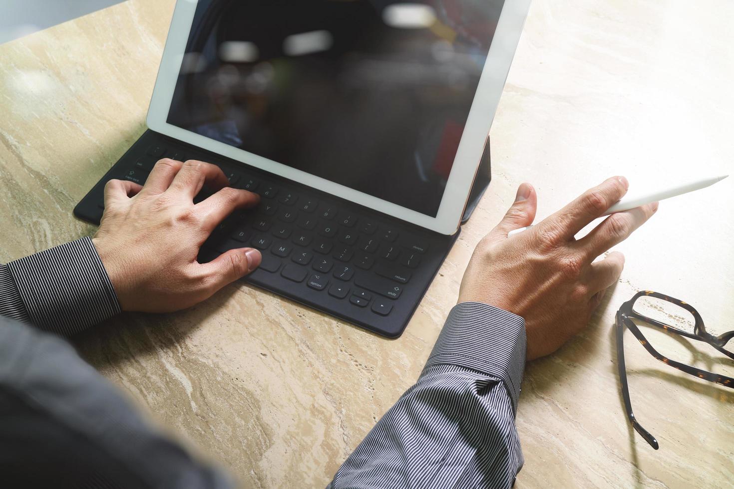 Businessman hand working concept. Photo investor working with new startup project. Finance managers meeting.Digital tablet keyboard dock screen computer design smart phone using. Sun flare effect