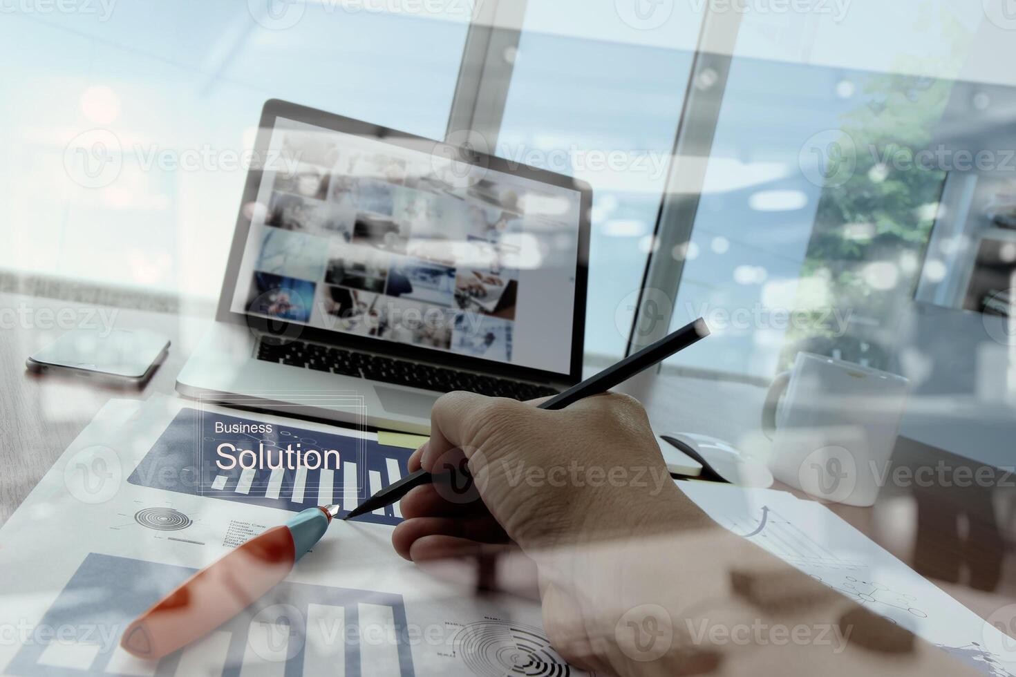 Double exposure of businessman hand working with new modern computer and business strategy as concept photo