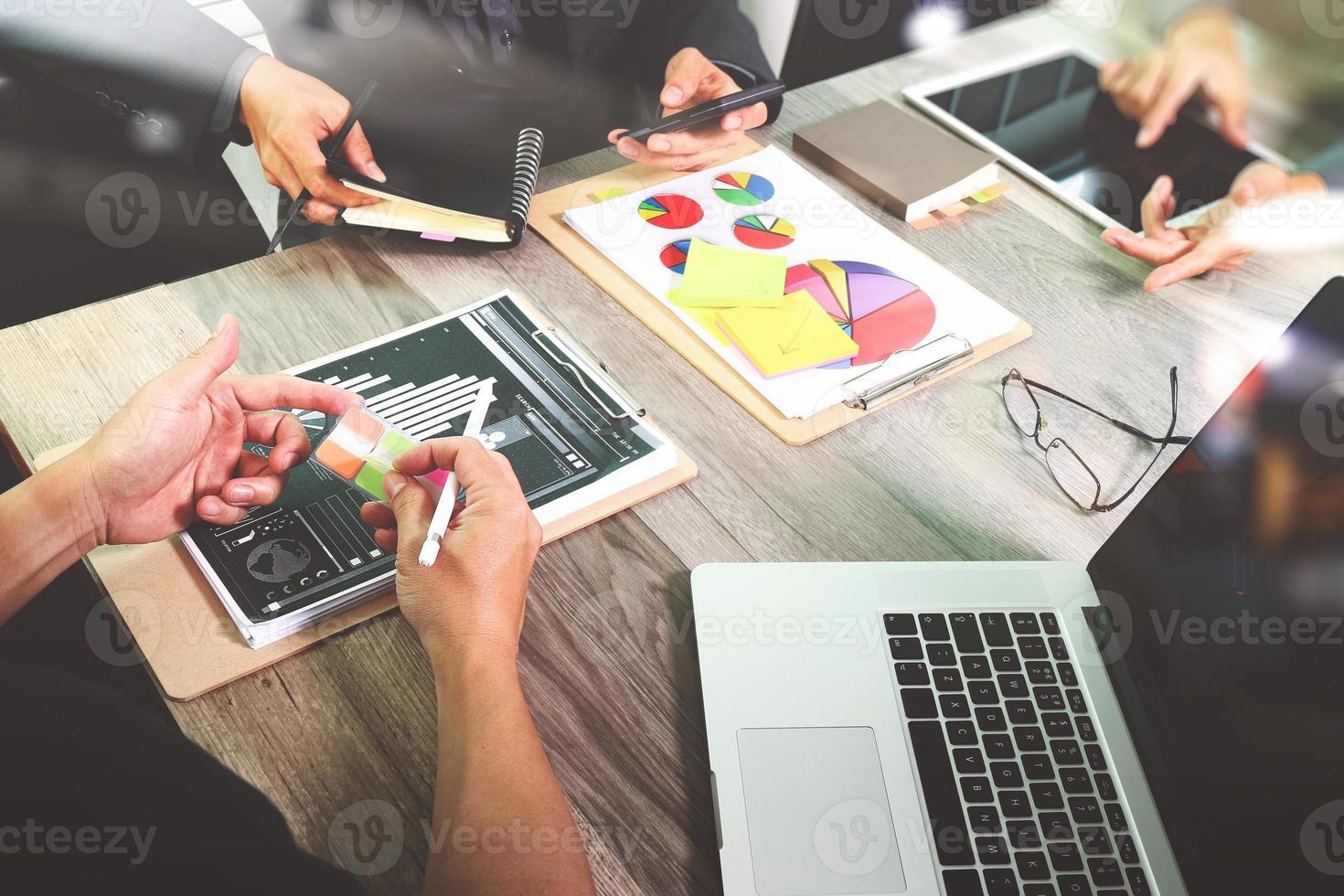 Businessman making presentation with his colleagues and business strategy digital layer effect at the office as concept photo