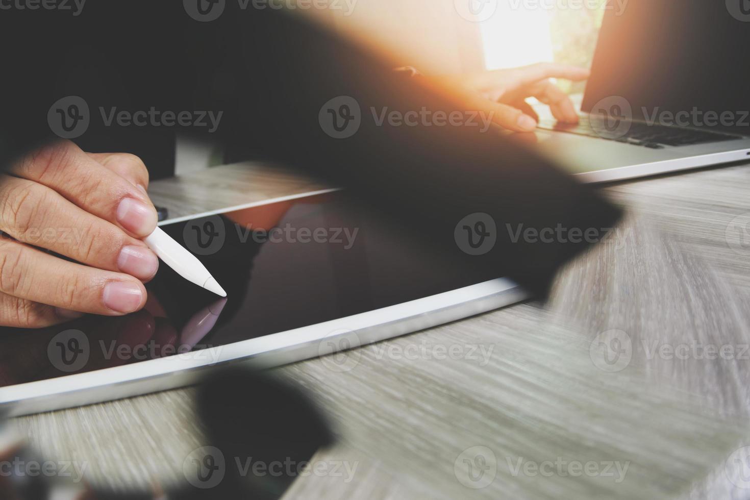 Website designer working blank screen digital tablet and computer laptop with smart phone on wooden desk as concept photo