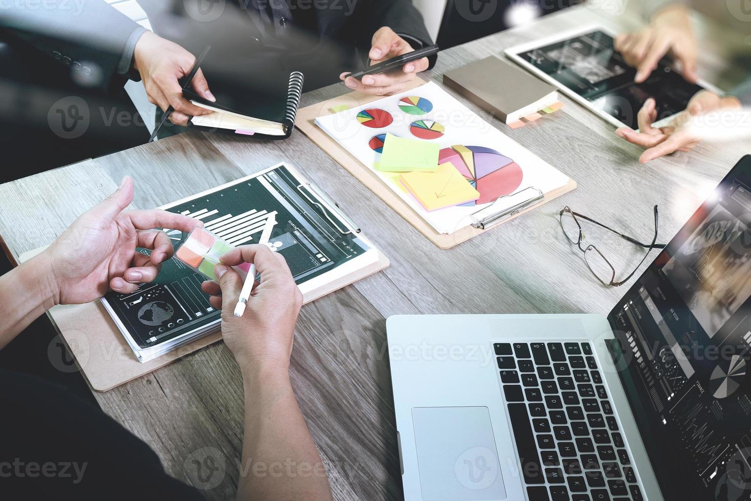 Businessman making presentation with his colleagues and business strategy digital layer effect at the office as concept photo