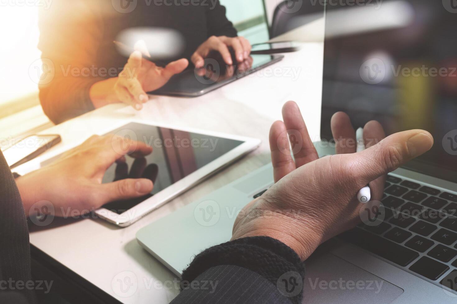 Business team meeting present. Photo professional investor working with new start up project. Finance managers task.Digital tablet laptop computer design smart phone using, Sun flare effect