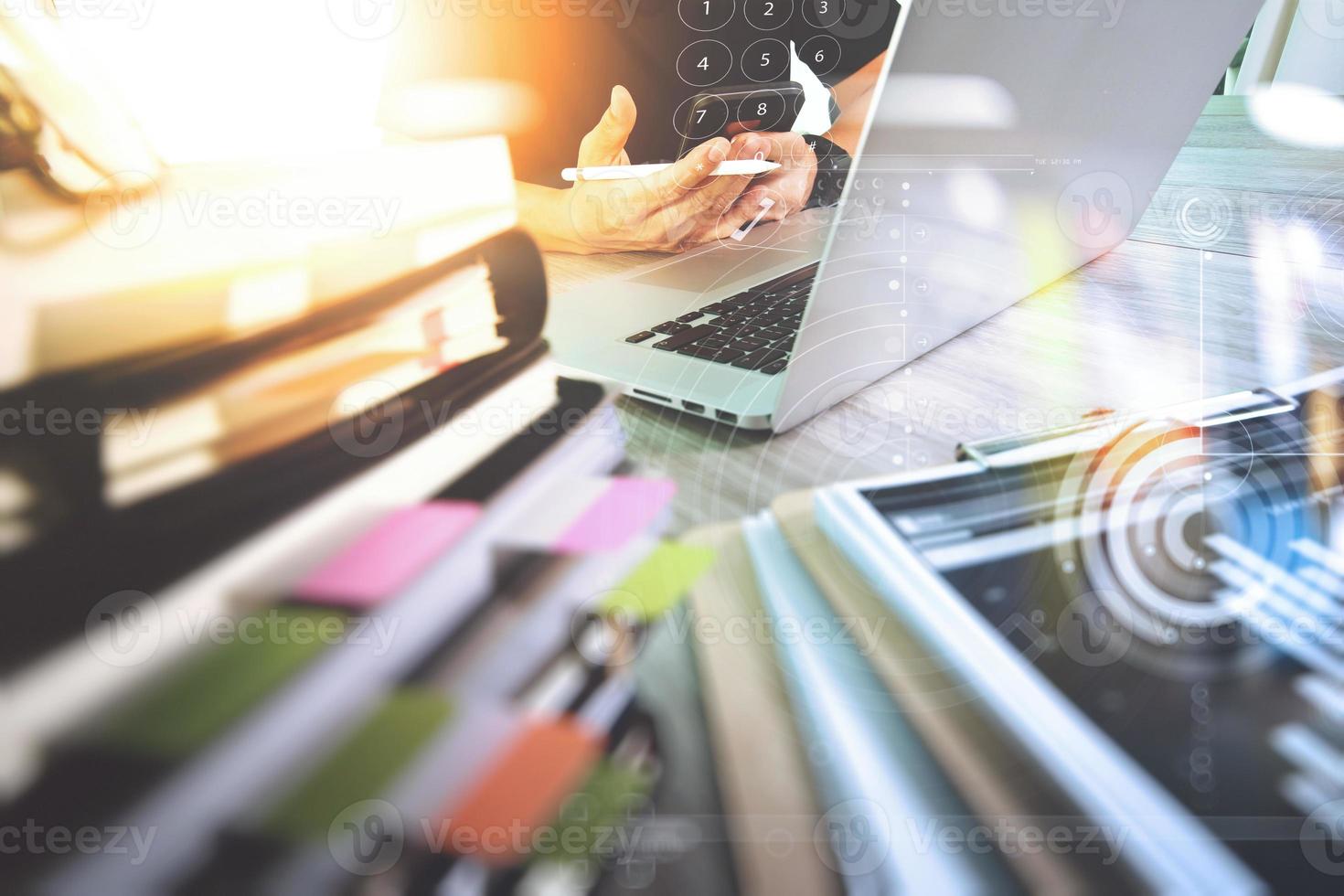 Website designer working digital tablet and computer laptop with smart phone and digital design diagram and stack of books on wooden desk as concep photo