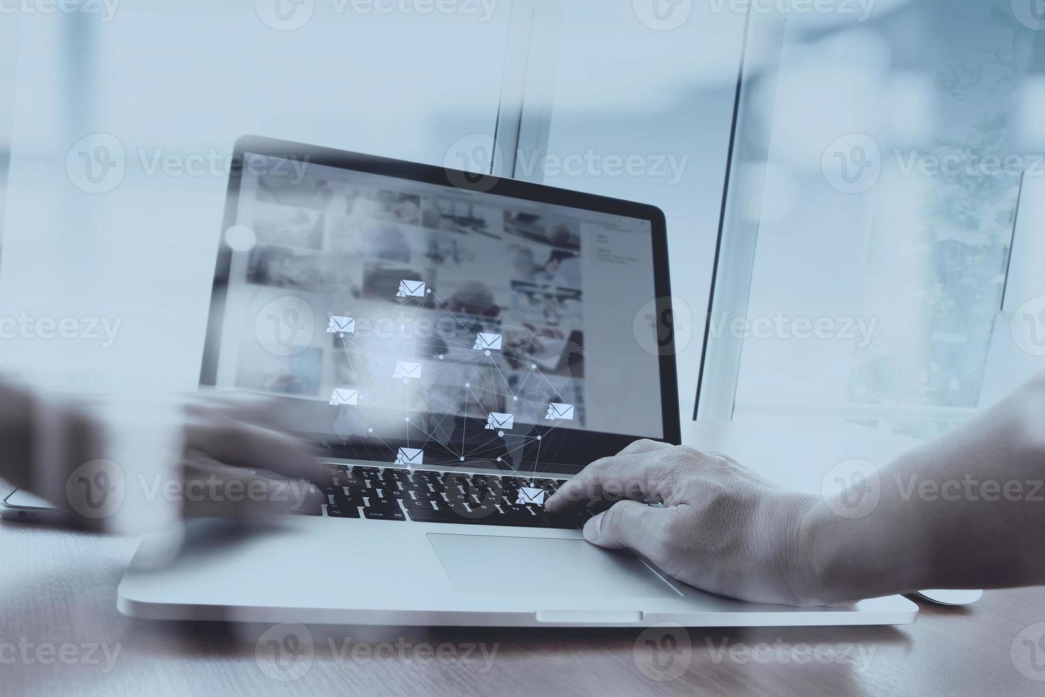 Double exposure of businessman hand working with new modern computer and business strategy as concept photo