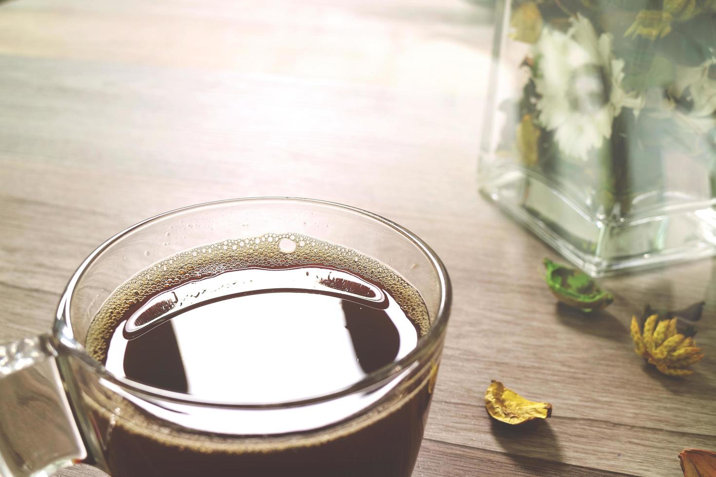 Coffee cup or tea ,glass vase dry flower herbs, on wooden table,filter effect,close up photo