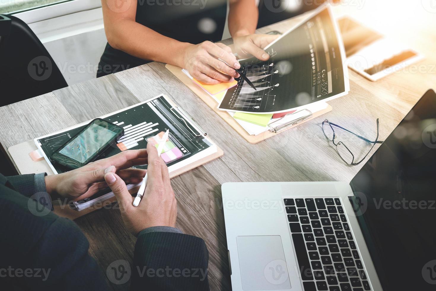 Businessman making presentation with his colleagues and business strategy digital layer effect at the office as concept photo