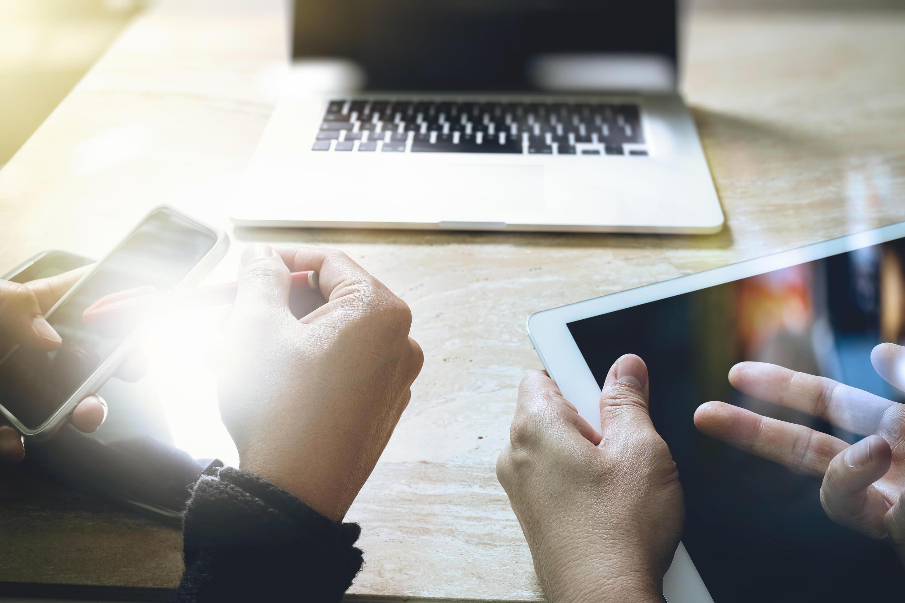 Businessman making presentation with his colleagues and business tablet ...