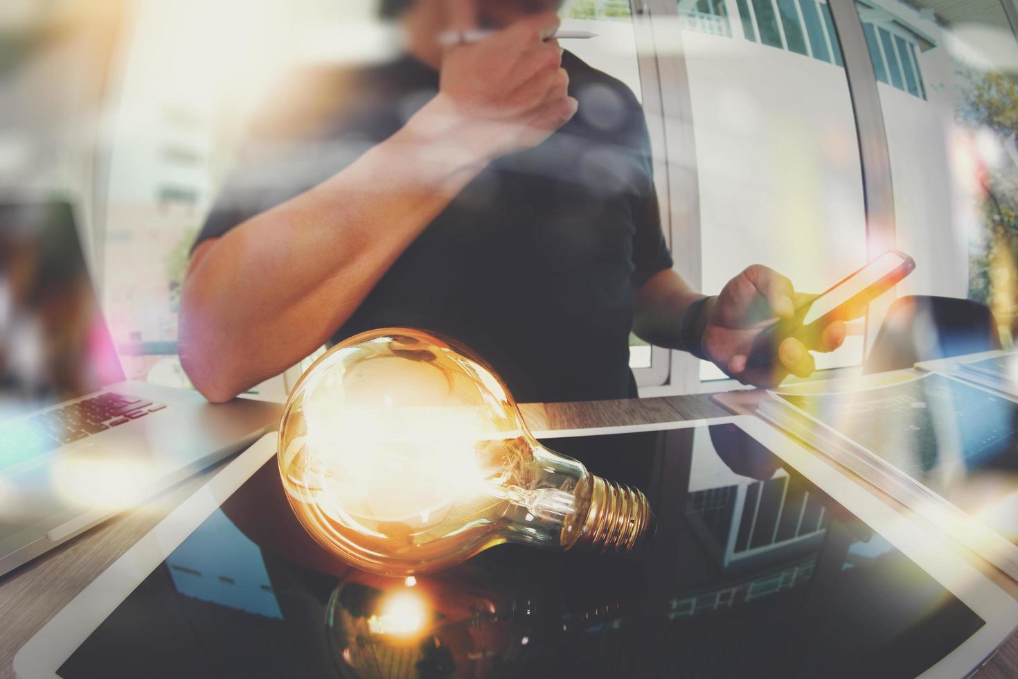 designer hand showing creative business strategy with light bulb as concept photo