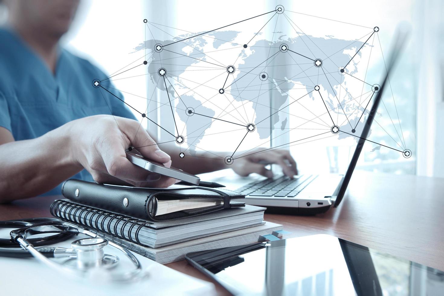 Doctor working with laptop computer in medical workspace office as concept photo