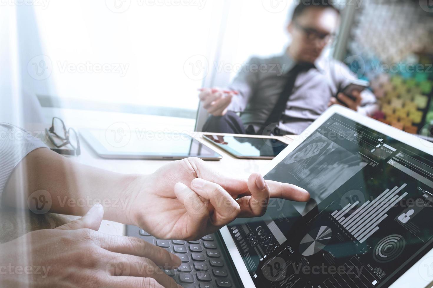 Business team meeting present. Photo professional investor working with new start up project. Digital tablet laptop computer design smart phone using, keyboard docking screen foreground,sun flare