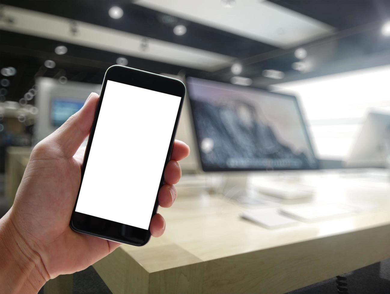 Closeup of Hand holding Blank Screen of Smart phone with blurred background as concept photo