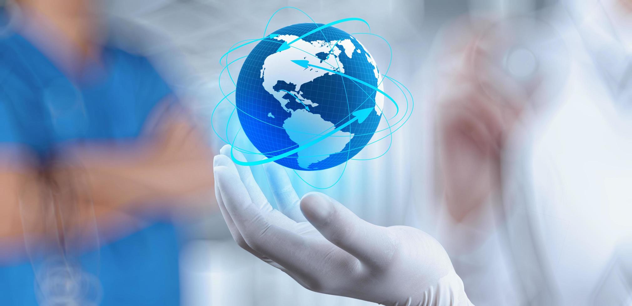 Medical Doctor holding a world globe in her hands as medical network concept photo