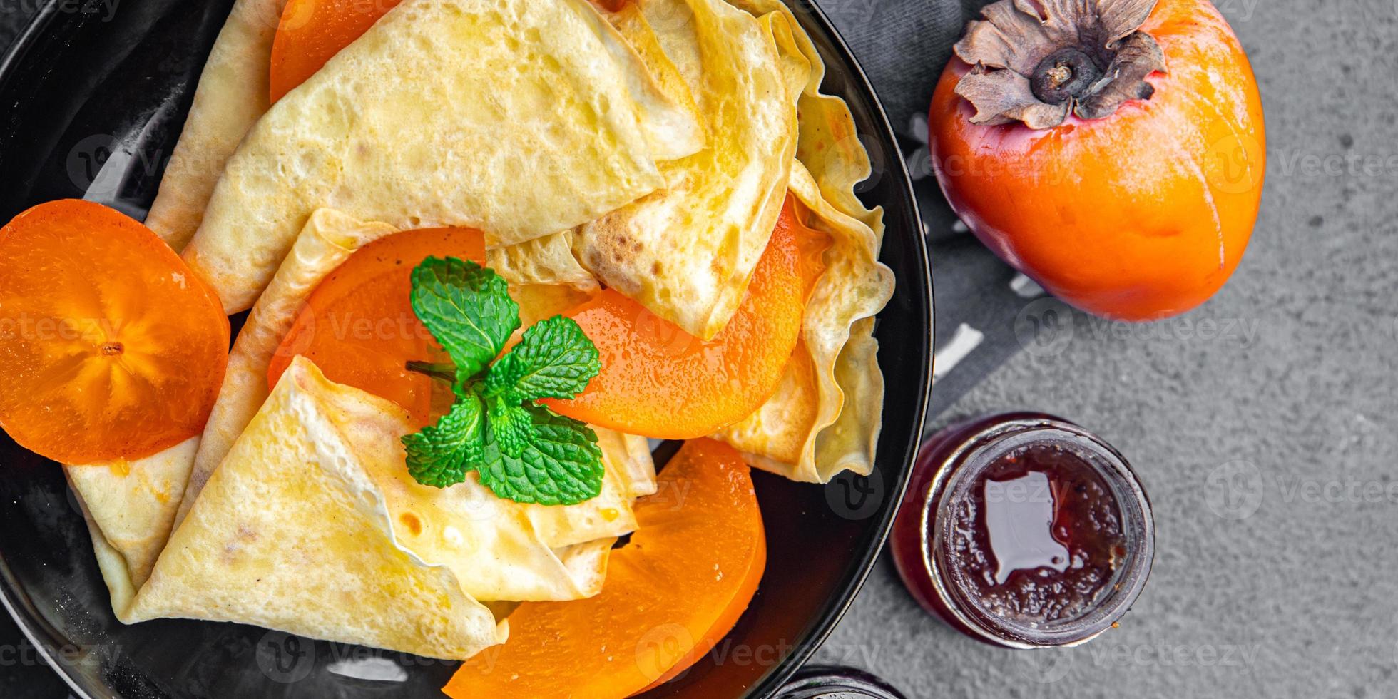 persimmon thin pancakes fruit crepe breakfast sweet dessert healthy meal photo