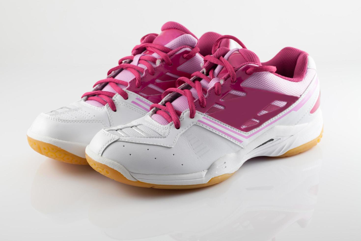 Badminton shoes on pink color photo
