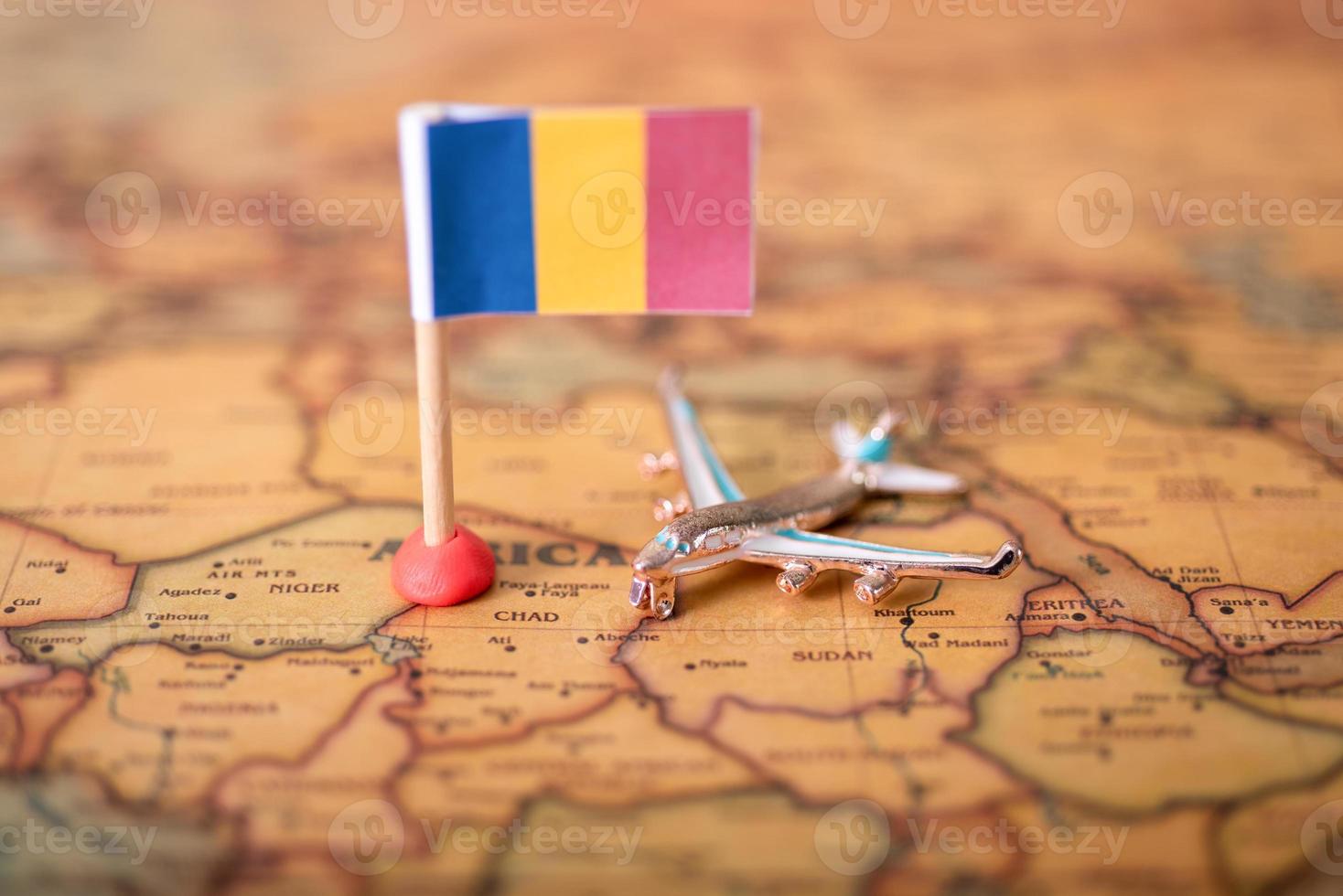 The flag of Romania and the plane on the world map. photo