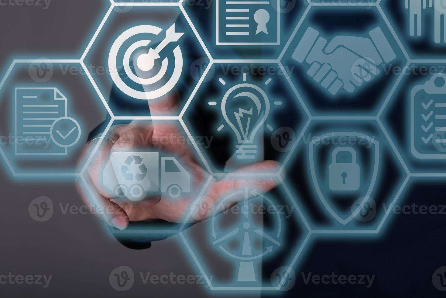 A businessman clicking on a target with a flat dart icon on a dark background. photo