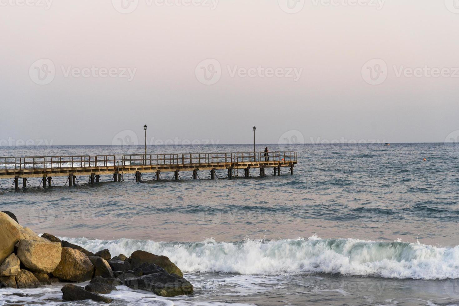 Wooden pier in Limassol overlooking the sea. photo