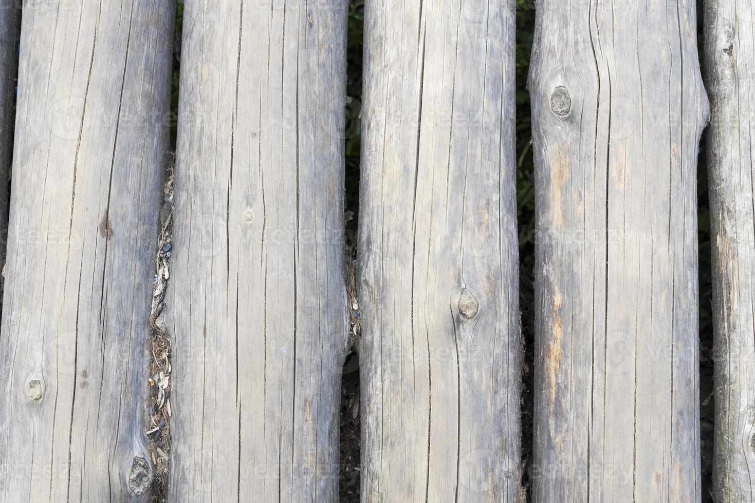 Modern Hand Hewn Natural Log Cabin Wall Facade Fragment Texture. Rustic Log Wall Horizontal Timber Background. photo