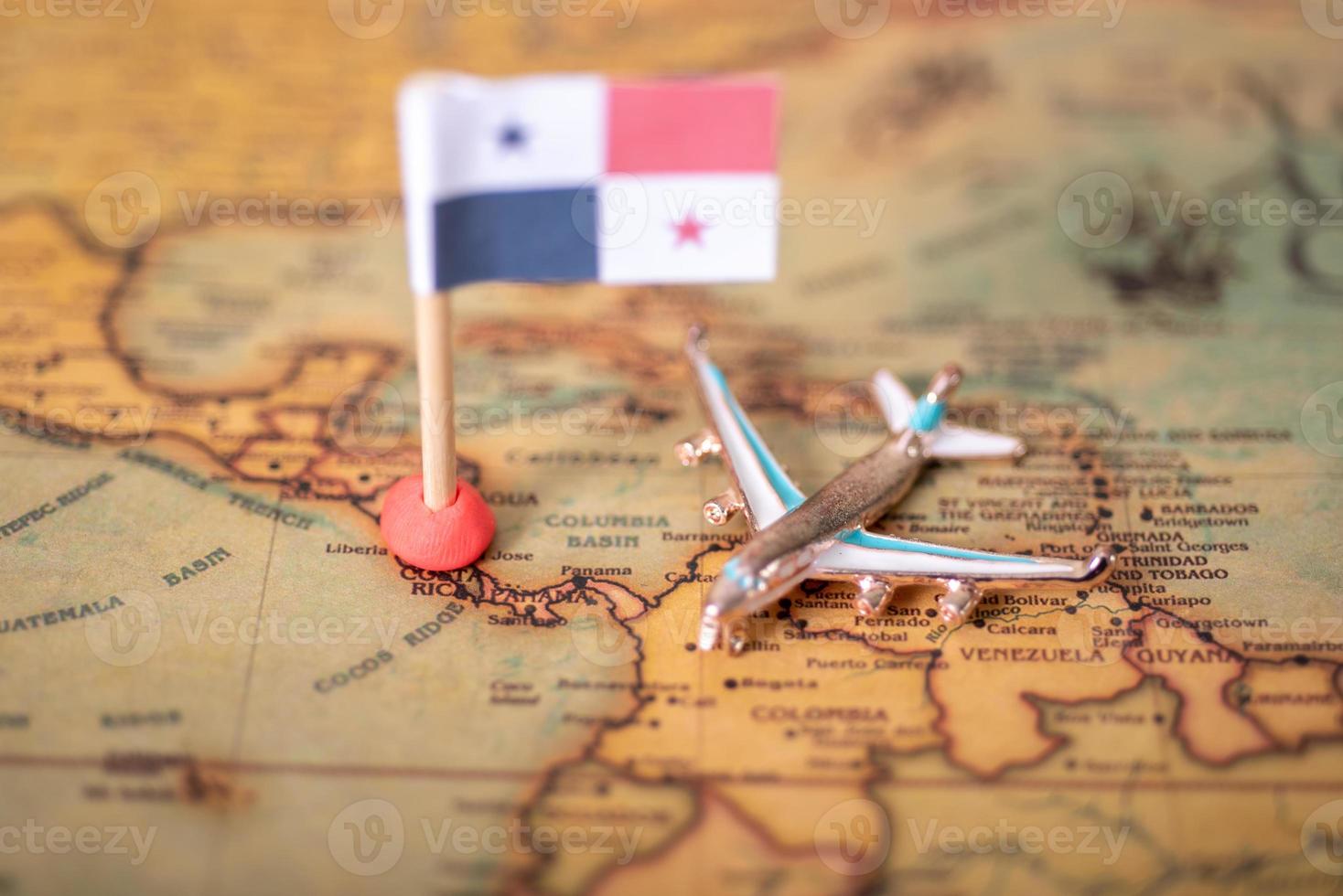 The flag of Panama and the plane on the world map. photo