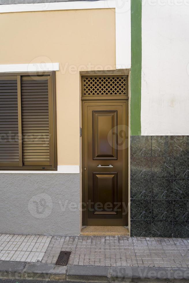 Closed metal brown door in a residential building. photo