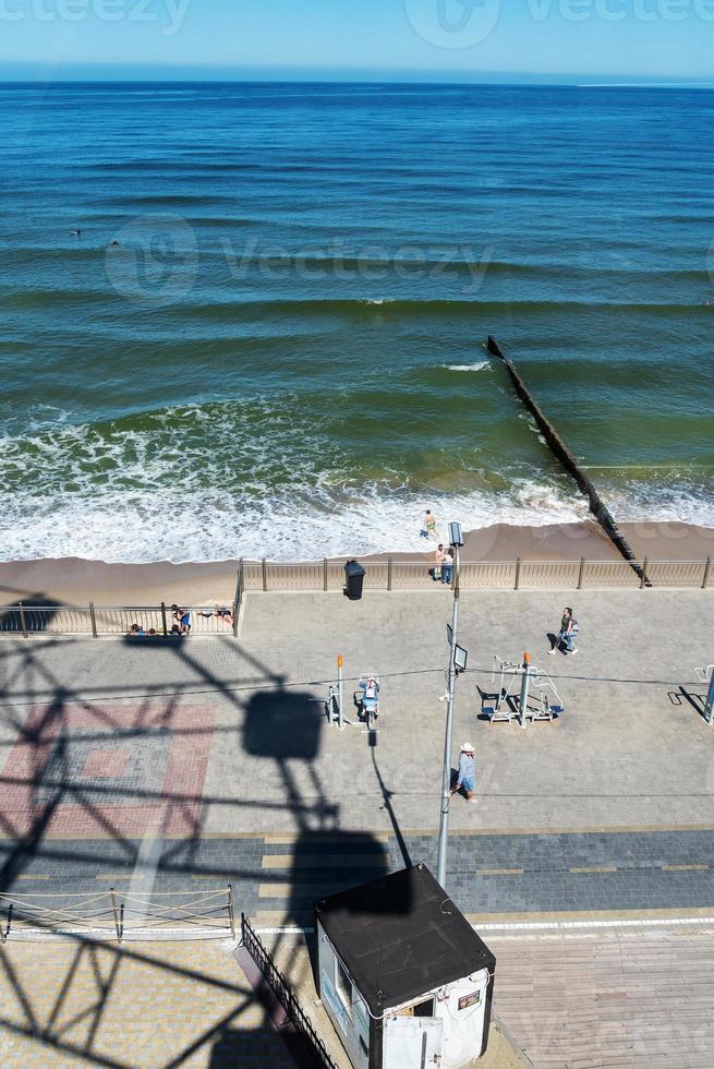 Zelenogradsk June 2021, The shadow of the Ferris wheel on the sand near the Baltic Sea coast photo