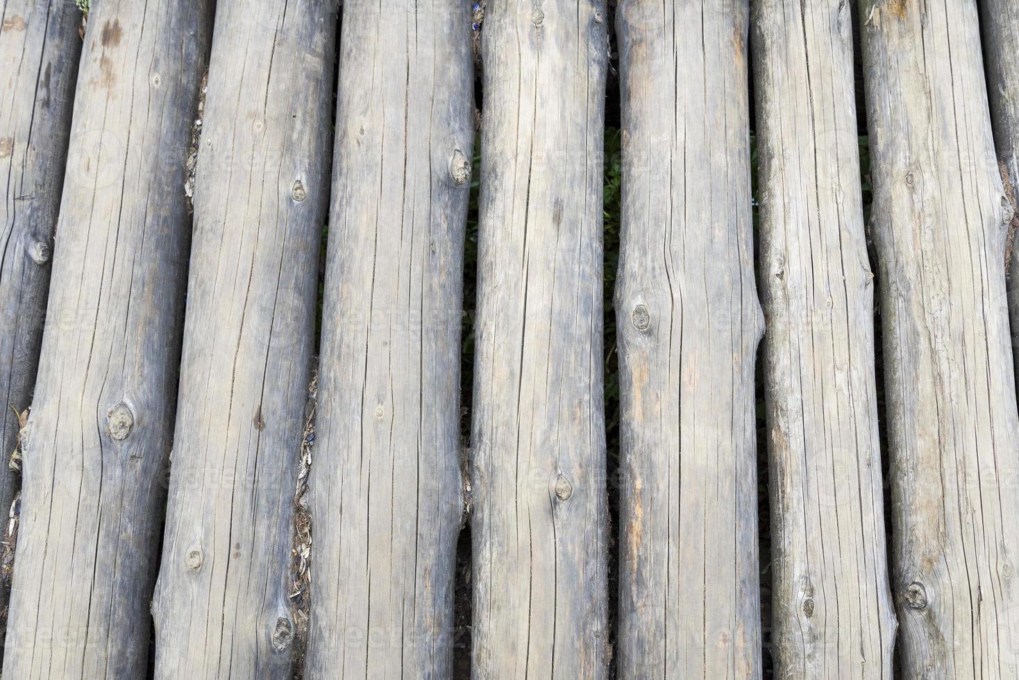 Modern Hand Hewn Natural Log Cabin Wall Facade Fragment Texture. Rustic Log Wall Horizontal Timber Background. photo