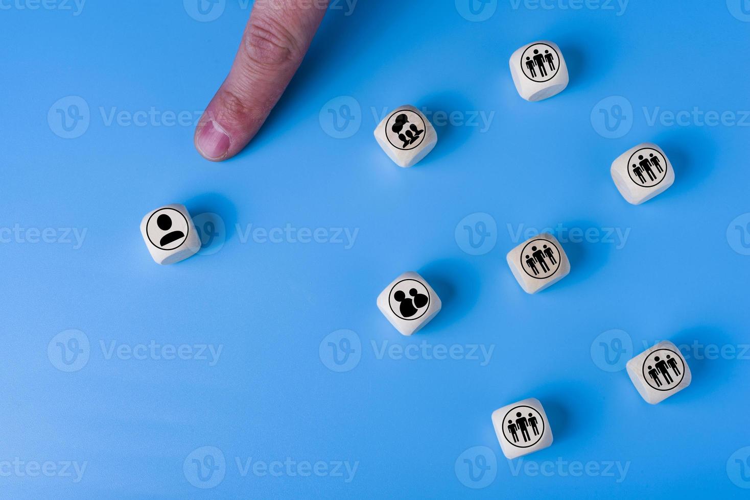 Boss concept with icons on wooden cubes, blue background. photo