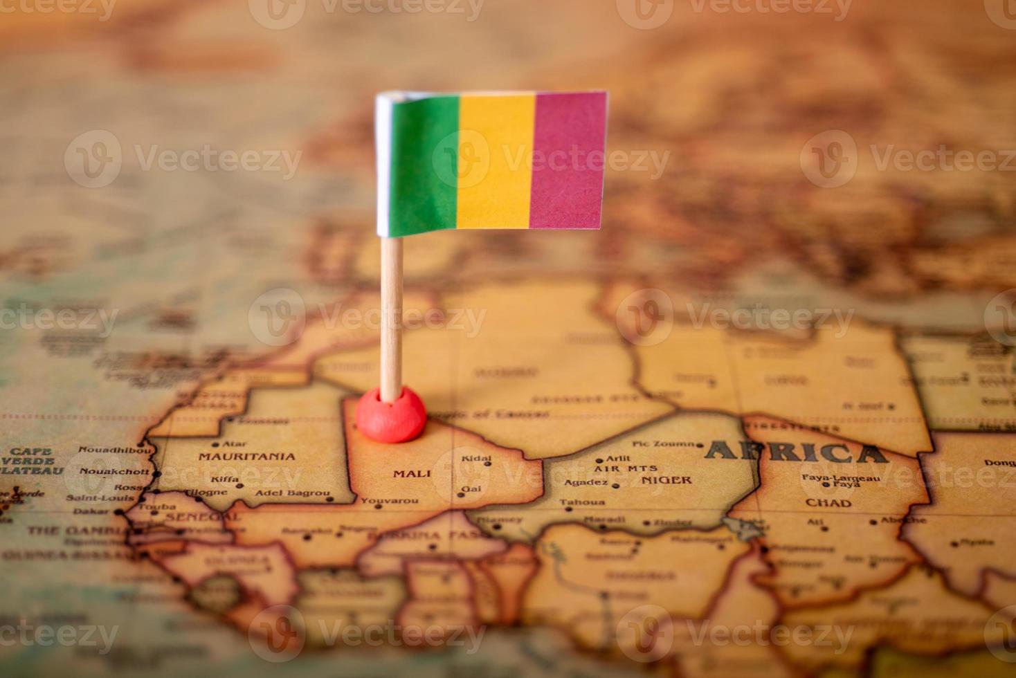 The flag of Mali on the world map. photo