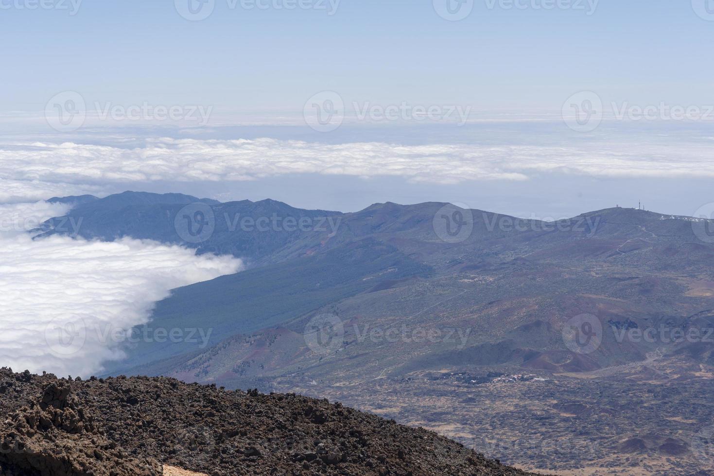 View from Teide Las Canadas Caldera volcano with solidified lava. Teide national Park mountain landscape above the clouds. Tenerife, Canary Islands, Spain. photo