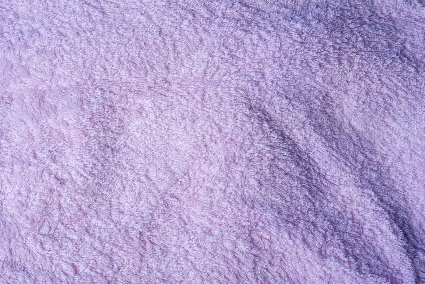 The texture of the Terry towel is light pink. photo