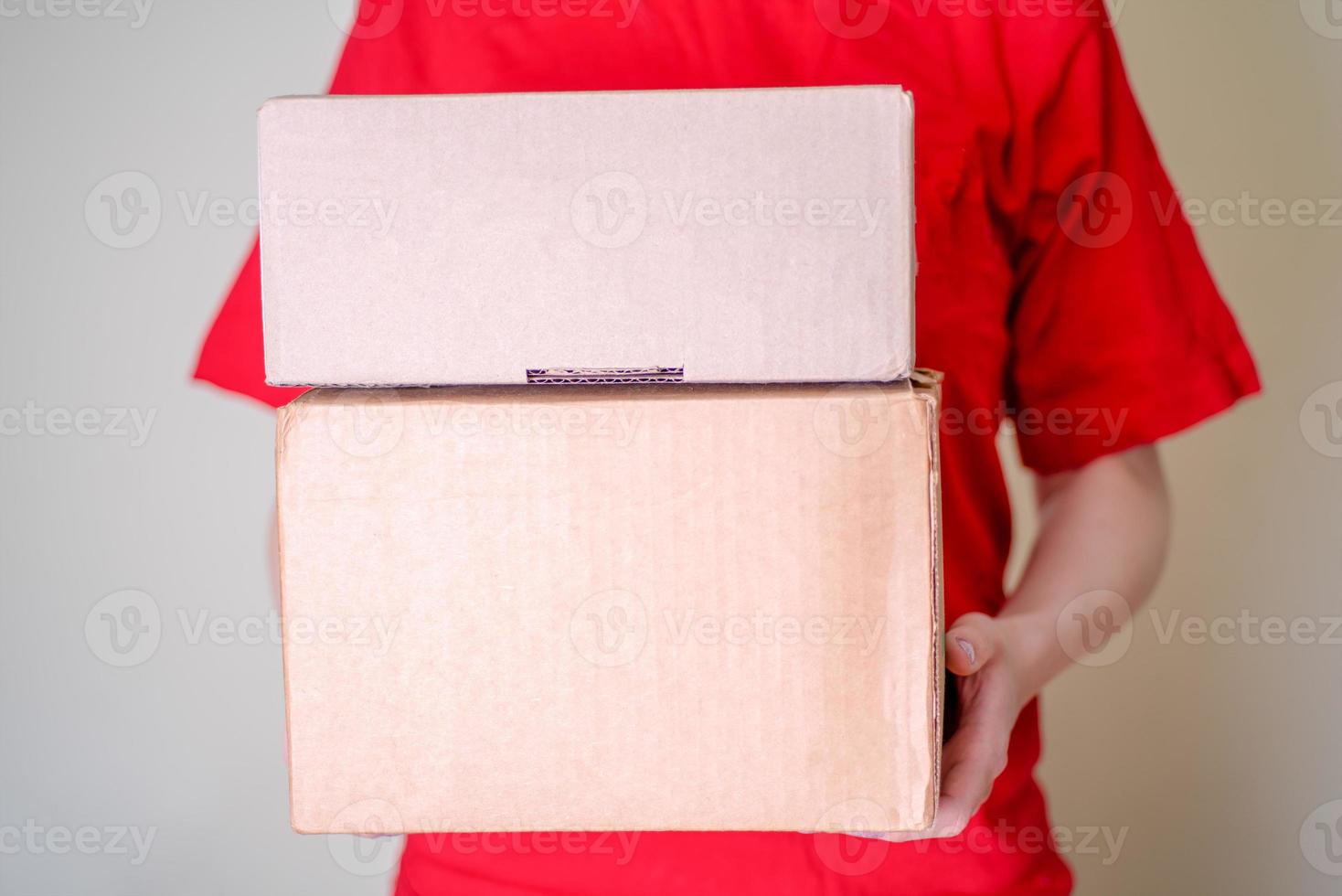 Girl holds a cardboard box for packaging and delivery, the package. photo