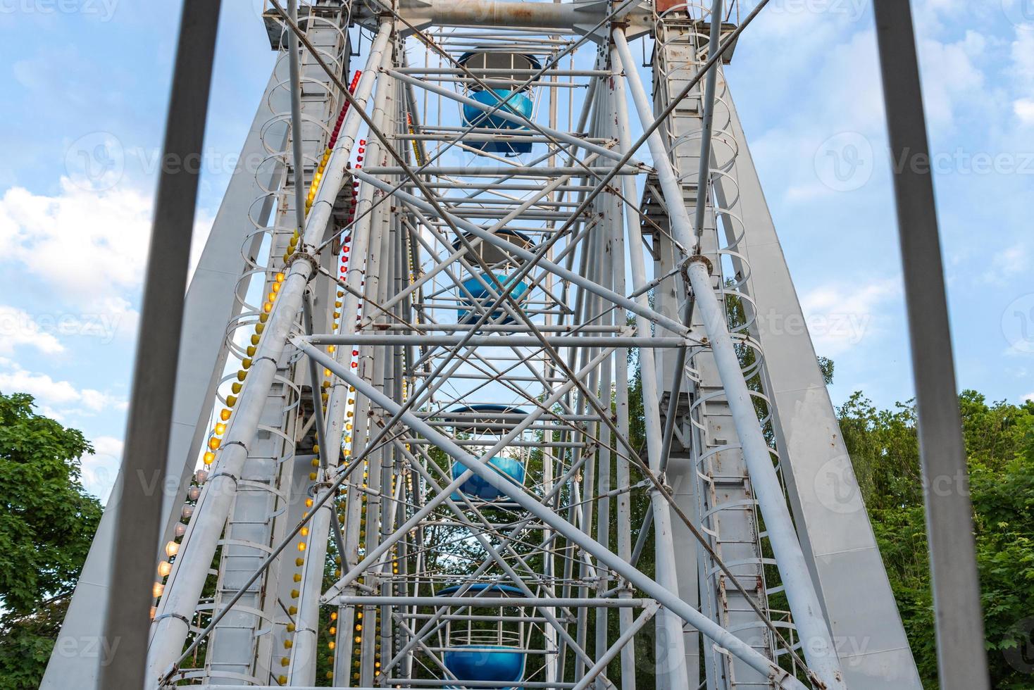 View of Inside of Ferris Wheel view of the structure with cabins. photo