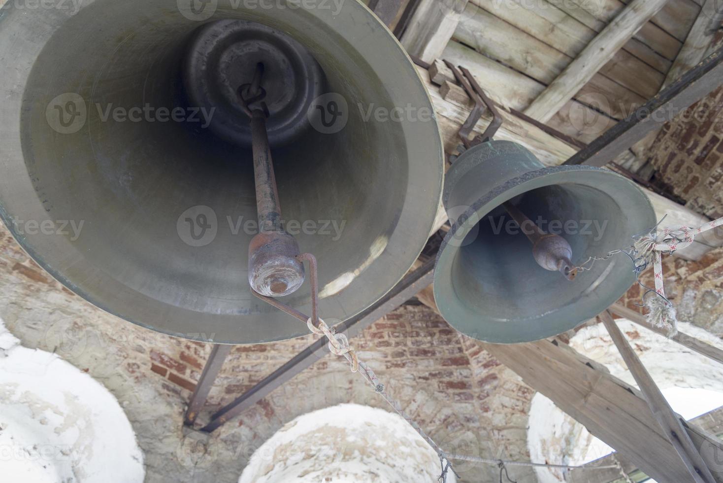 Hanging bells on the bell tower in the Church. photo