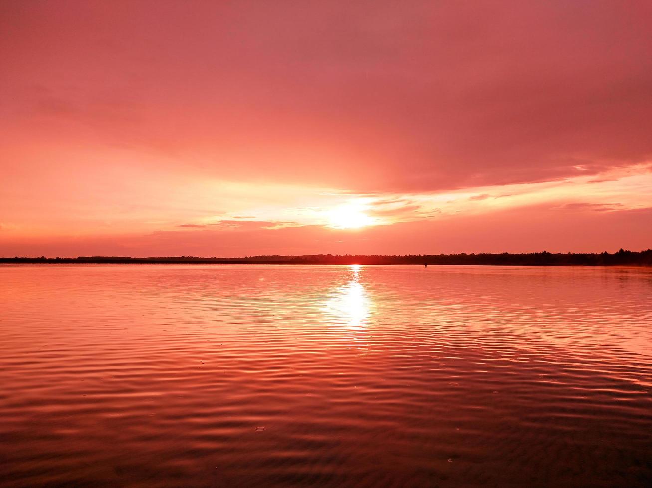 View of the lake at sunset in the evening photo