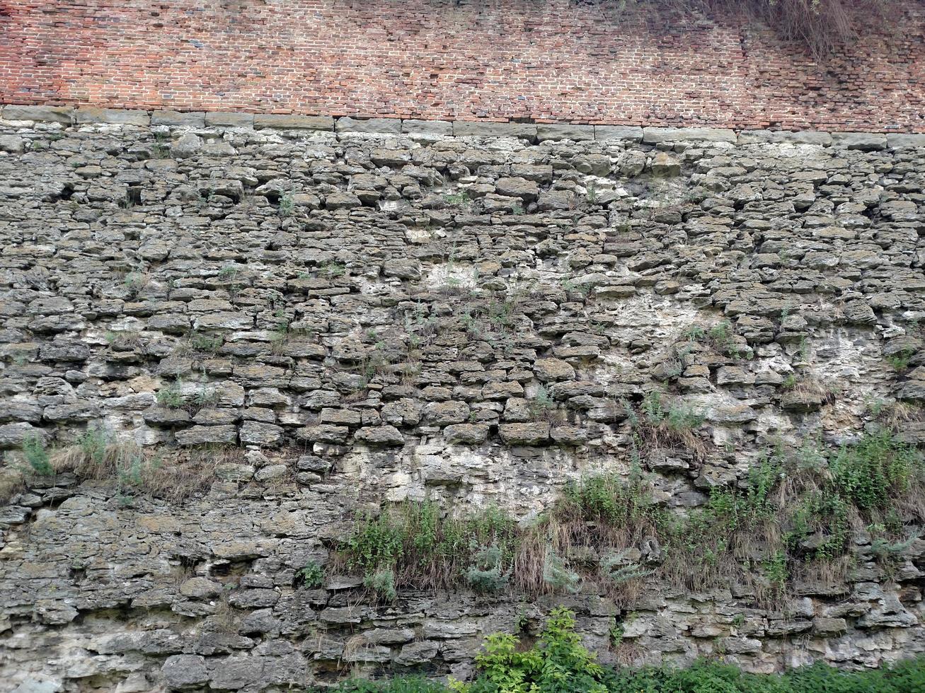The wall of the fortress in the city of Dubno. On a summer day. photo