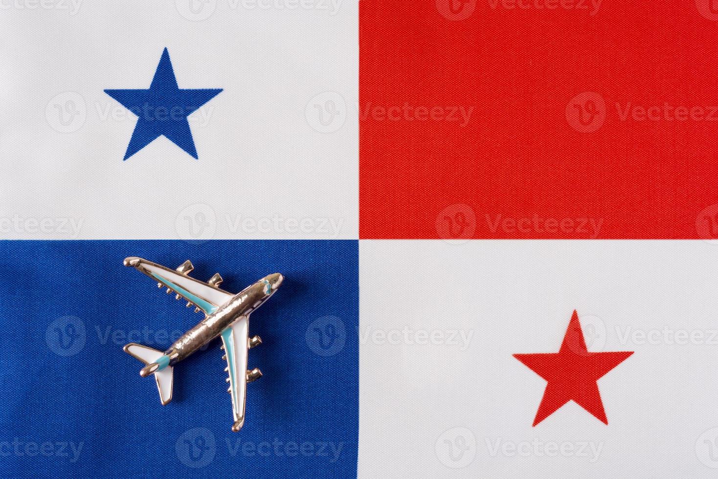 Plane over the flag of Panama travel concept. photo