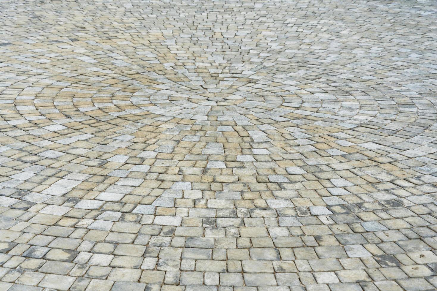 Stone paving circle texture. Abstract structured background of modern street pavement slabs pattern photo